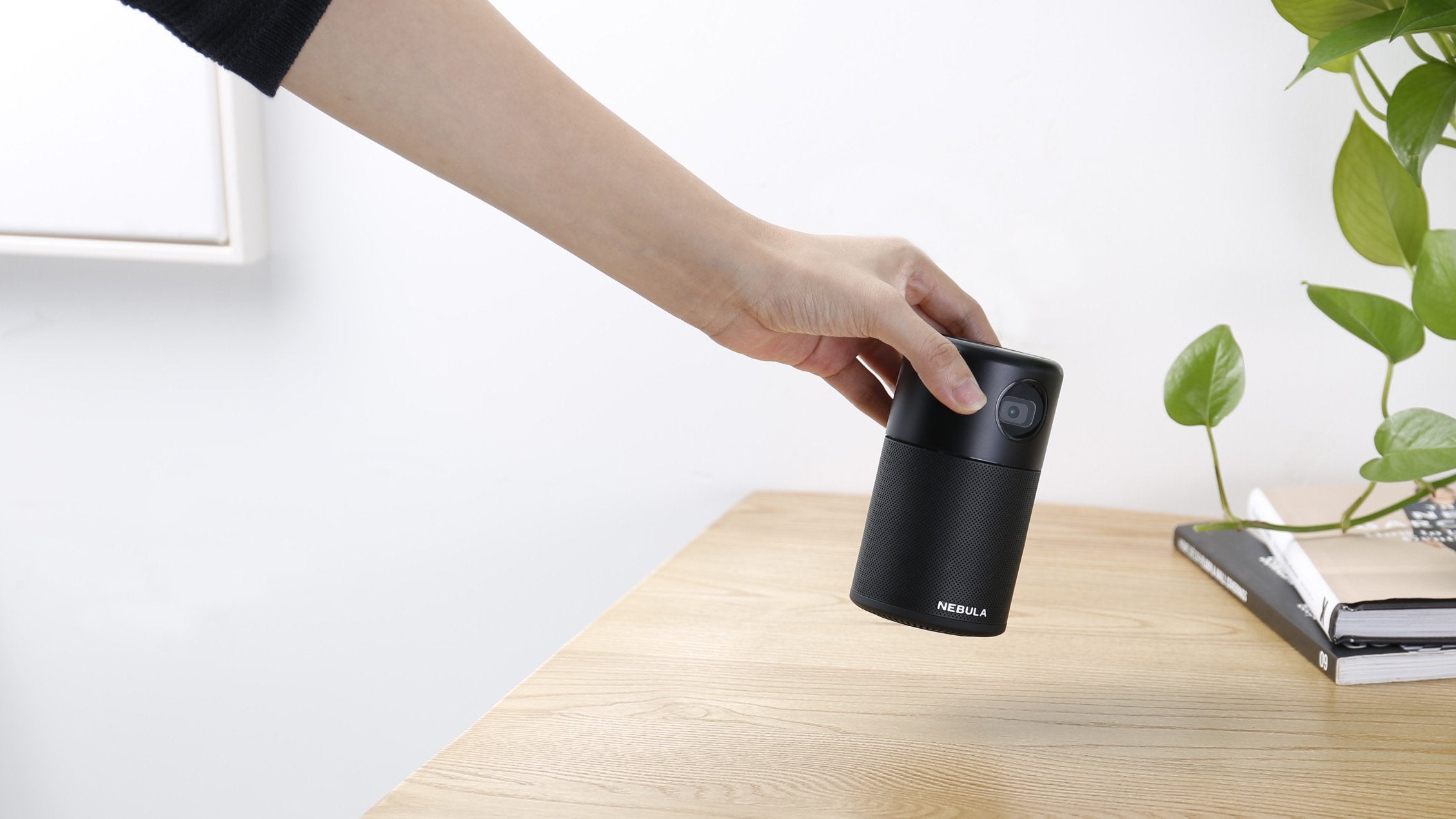 This pocket projector is the perfect companion for jet setters